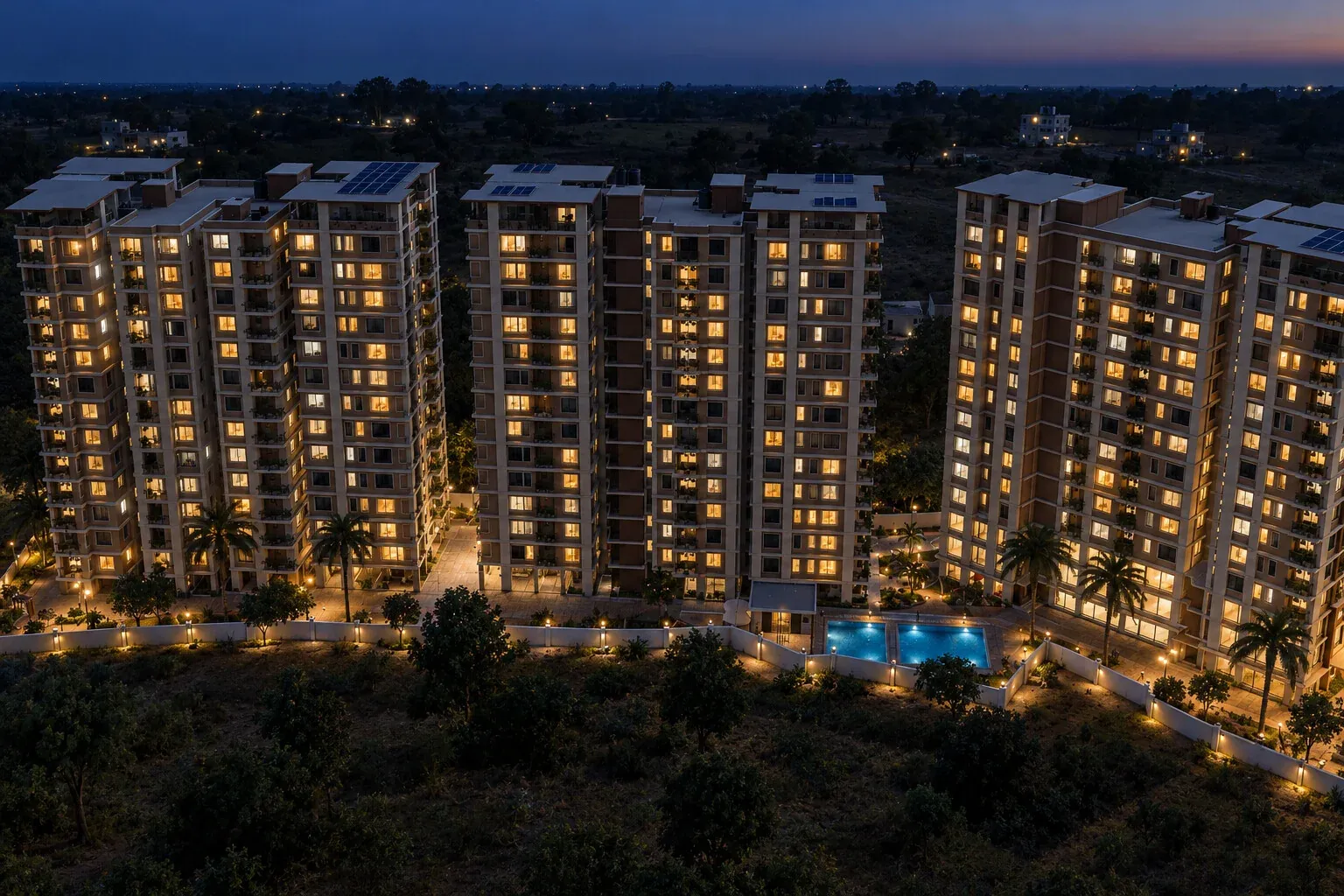 The towers at night, every floor lit